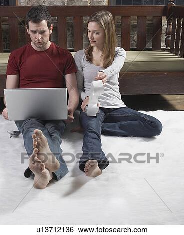 Stock Photograph - Worried Couple Managing Finance. Fotosearch
