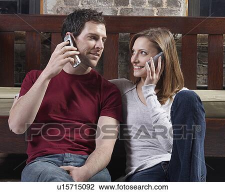 Couple Talking on Mobile Phones View Large Photo Image Stock Image - Couple Talking on Mobile Phones. Fotosearch