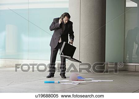Mid Adult Businessman on Phone with Documents on Floor View Large Photo Image Stock Photography - Mid Adult Businessman on Phone with Documents on Floor. Fotosearch
