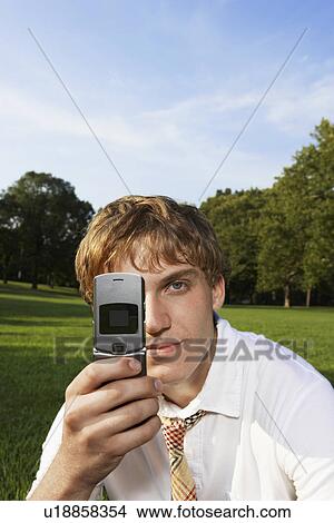 Teenage boy using mobile phone View Large Photo Image Picture - Teenage boy using mobile phone. Fotosearch
