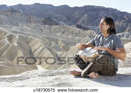 Man playing drums in desert, Death Valley, California, USA View Large Photo Image Stock Photography - Man playing drums in desert, Death Valley, California, USA. Fotosearch