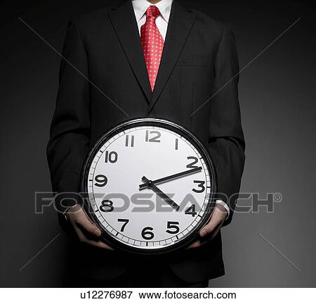 Businessman Holding Clock View Large Photo Image Stock Photo - Businessman Holding Clock. Fotosearch