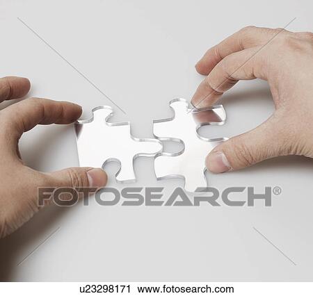 Person Doing Jigsaw Puzzle View Large Photo Image Stock Image - Person Doing Jigsaw Puzzle. Fotosearch