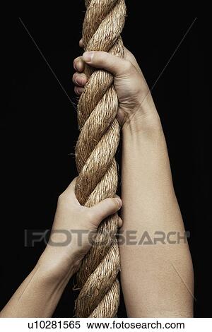 Stock Photography - Person Pulling Rope. Fotosearch