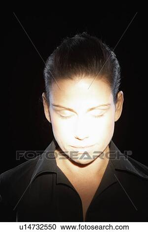 Woman's face in spotlight View Large Photo Image Stock Image - Woman's face in spotlight. Fotosearch