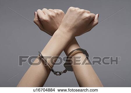 Woman's hands in handcuffs (close-up) View Large Photo Image Picture - Woman's hands in handcuffs (close-up). Fotosearch
