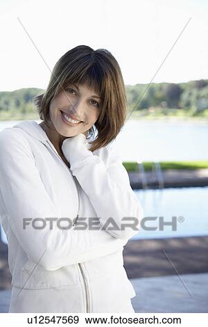 Woman in white sweatshirt smiling (portrait) View Large Photo Image Stock Photo - Woman in white sweatshirt smiling (portrait). Fotosearch