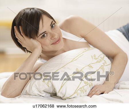 Young Woman Lying in Bed View Large Photo Image Stock Photo - Young Woman Lying in Bed. Fotosearch