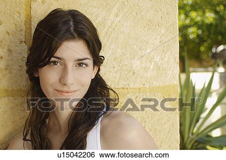 Stock Photograph - Young woman smiling (portrait). Fotosearch