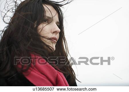 Young woman with tousled hair View Large Photo Image Stock Photo - Young woman with tousled hair. Fotosearch