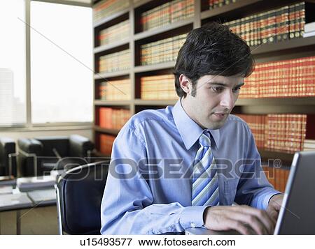 Stock Photo - Businessman working on laptop. Fotosearch