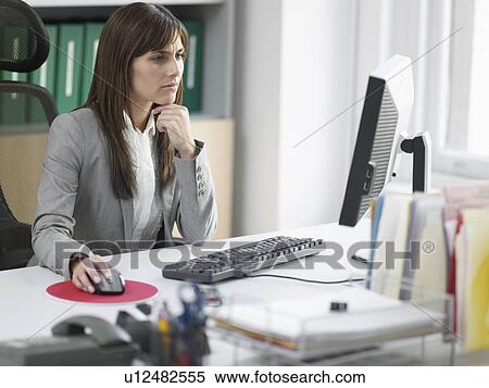 Worried Female Office Worker at Desk View Large Photo Image Stock Photography - Worried Female Office Worker at Desk. Fotosearch