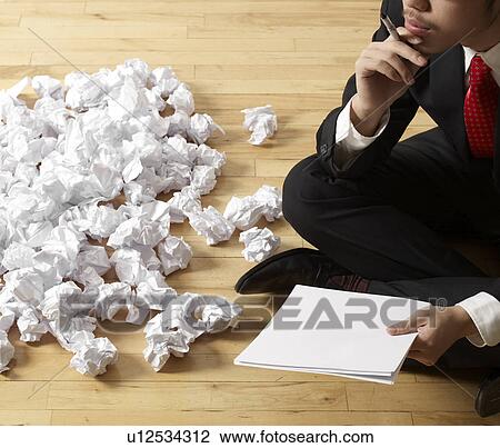 Businessman Thinking beside Crumpled Paper View Large Photo Image Stock Image - Businessman Thinking beside Crumpled Paper. Fotosearch