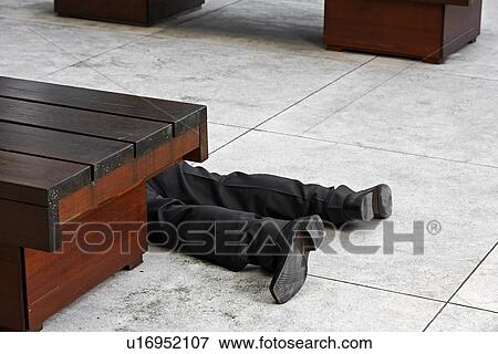 Low Section of Businessman Lying on Tiled Floor View Large Photo Image Stock Photo - Low Section of Businessman Lying on Tiled Floor. Fotosearch