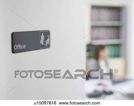 Office Sign, Office Worker in Background View Large Photo Image Stock Photograph - Office Sign, Office Worker in Background. Fotosearch