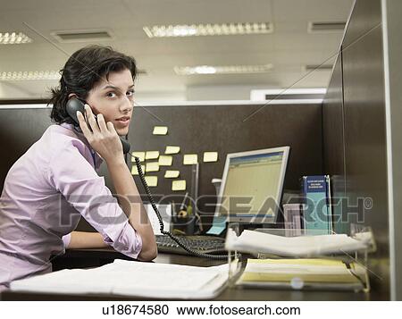 Office worker on phone View Large Photo Image Stock Image - Office worker on phone. Fotosearch