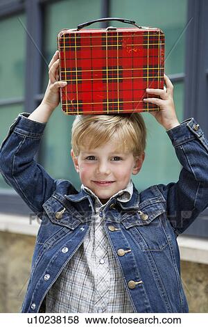 Stock Photo - Boy holding briefcase. Fotosearch