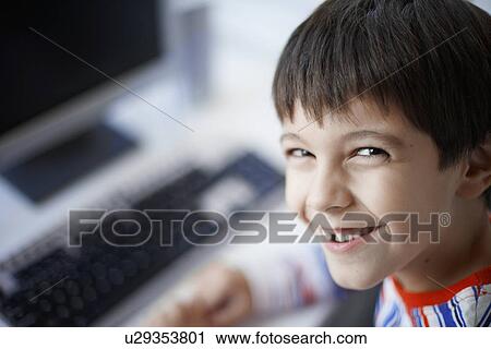 Boy near computer (portrait) View Large Photo Image Stock Image - Boy near computer (portrait). Fotosearch