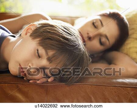 Mother and son sleeping on sofa View Large Photo Image Stock Image - Mother and son sleeping on sofa. Fotosearch