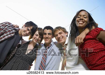 Portrait of five teenagers (low angle view) View Large Photo Image Stock Image - Portrait of five teenagers (low angle view). Fotosearch