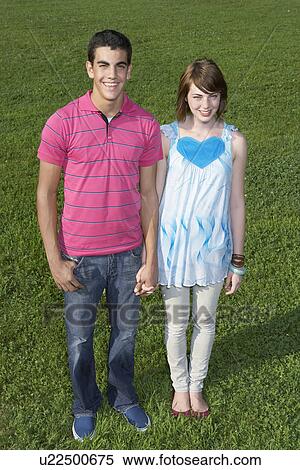 Stock Photography - Portrait of teenage couple (high angle view). Fotosearch