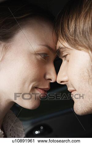 Young couple looking at each other View Large Photo Image Stock Image - Young couple looking at each other. Fotosearch