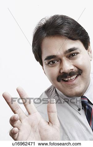 Portrait of a businessman gesturing View Large Photo Image Stock Image - Portrait of a businessman gesturing. Fotosearch