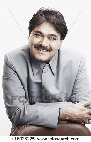 Stock Photography - Portrait of a businessman smiling. Fotosearch
