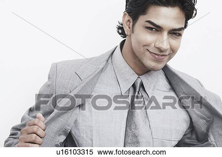 Portrait of a businessman smiling View Large Photo Image Stock Photography - Portrait of a businessman smiling. Fotosearch