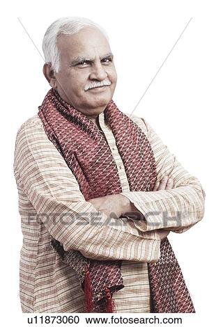 Portrait of a mature man standing with his arms crossed View Large Photo Image Stock Image - Portrait of a mature man standing with his arms crossed. Fotosearch