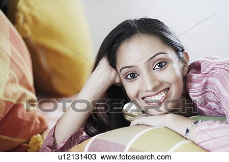 Portrait of a teenage girl smiling View Large Photo Image Stock Image - Portrait of a teenage girl smiling. Fotosearch