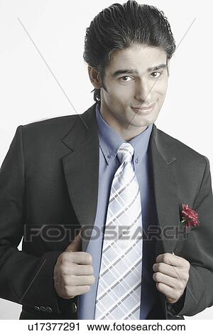 Portrait of a young man wearing a suit View Large Photo Image Stock Image - Portrait of a young man wearing a suit. Fotosearch