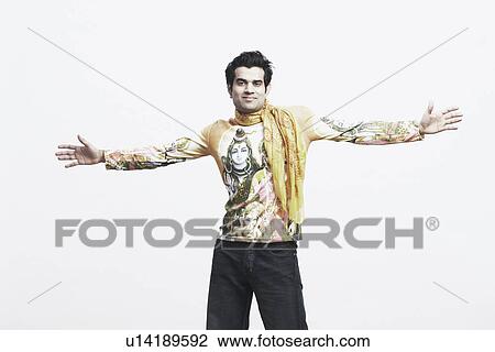 Portrait of a young man with his arms outstretched View Large Photo Image Stock Image - Portrait of a young man with his arms outstretched. Fotosearch