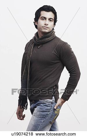 Stock Photo - Portrait of a young man with his hand in his pocket. Fotosearch