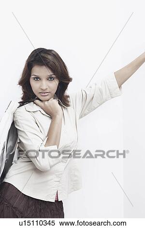 Stock Photography - Portrait of a young woman carrying a shopping bag. Fotosearch