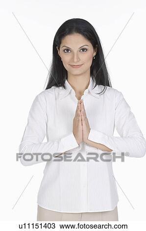 Portrait of a young woman with her hands together View Large Photo Image Stock Image - Portrait of a young woman with her hands together. Fotosearch
