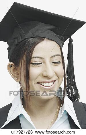 Close-up of a female graduate with her eyes closed View Large Photo Image Stock Image - Close-up of a female graduate with her eyes closed. Fotosearch