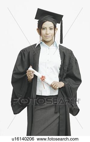 Stock Photograph - Portrait of a female graduate holding a diploma. Fotosearch