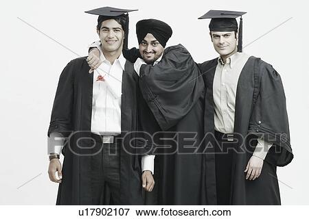 Portrait of three male graduates smiling View Large Photo Image Stock Photo - Portrait of three male graduates smiling. Fotosearch