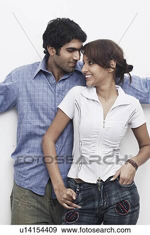 Stock Photo - Close-up of a young couple smiling. Fotosearch