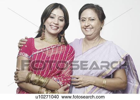 Portrait of a mature woman and a mid adult woman smiling View Large Photo Image Stock Image - Portrait of a mature woman and a mid adult woman smiling. Fotosearch