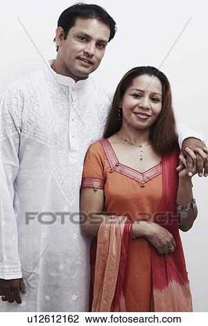 Portrait of a mid adult couple holding hands View Large Photo Image Stock Image - Portrait of a mid adult couple holding hands. Fotosearch