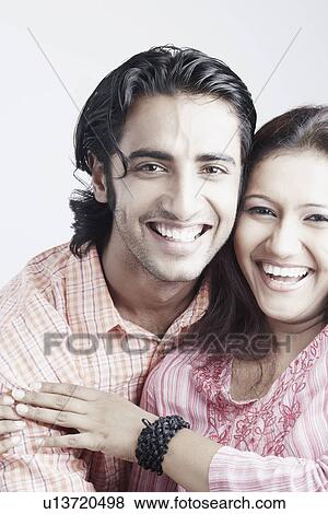 Portrait of a young couple smiling View Large Photo Image Stock Photo - Portrait of a young couple smiling. Fotosearch