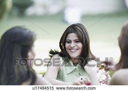 Stock Photography - Young woman sitting. Fotosearch