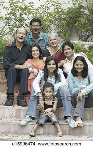 Picture - Portrait of a family sitting together on steps. Fotosearch