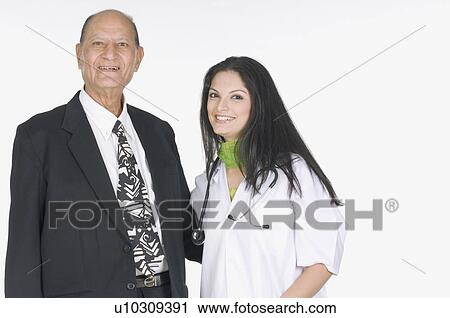 Stock Image - Portrait of a father and his daughter smiling. Fotosearch