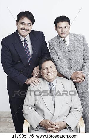 Portrait of a father and his two sons smiling View Large Photo Image Stock Photograph - Portrait of a father and his two sons smiling. Fotosearch