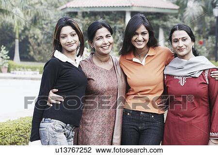 Portrait of a mature woman and her three daughters View Large Photo Image Stock Image - Portrait of a mature woman and her three daughters. Fotosearch