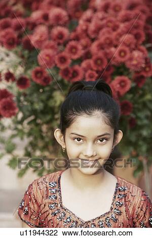 Stock Image - Portrait of a girl smiling. Fotosearch