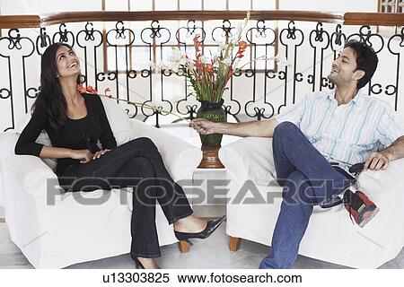 Young man flirting with a young woman View Large Photo Image Stock Photography - Young man flirting with a young woman. Fotosearch